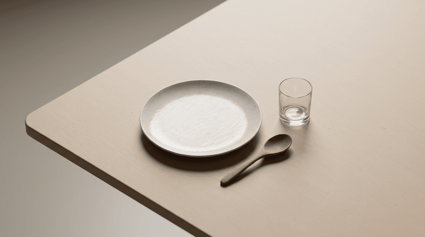 Close-up of walnut dining table surface with fruit bowl